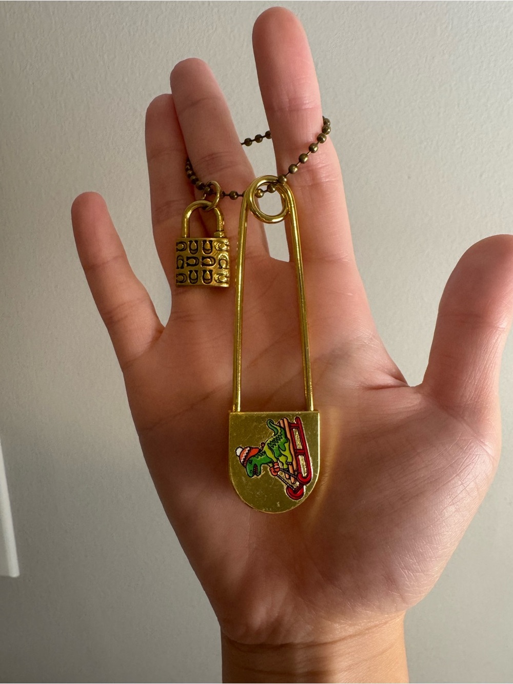 Coach lock charm and large safety pin with customized Christmas rexy